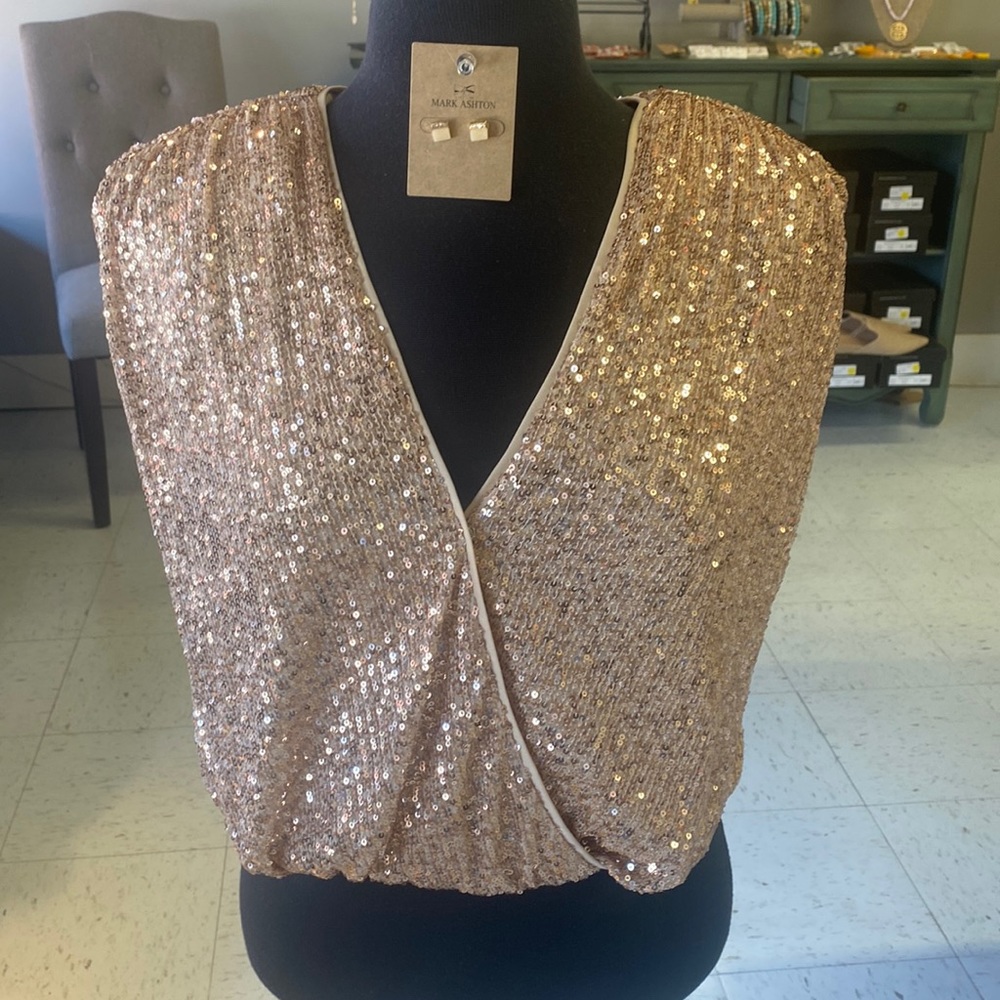 Sequined body suit.  Super cute and fun for many occasions!